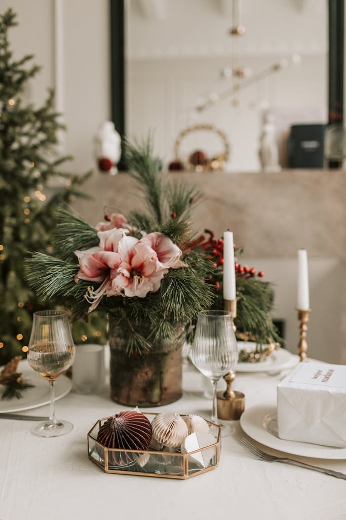 A beautifully arranged Christmas table setting featuring a floral centerpiece and decorative elements.